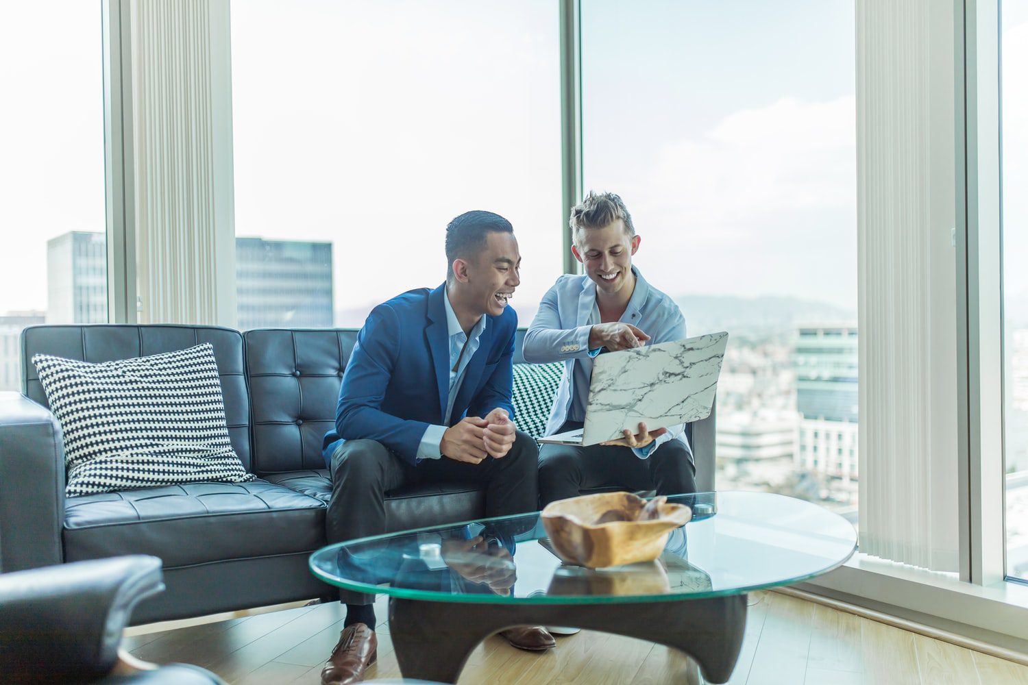 real estate agent talking on couch with client