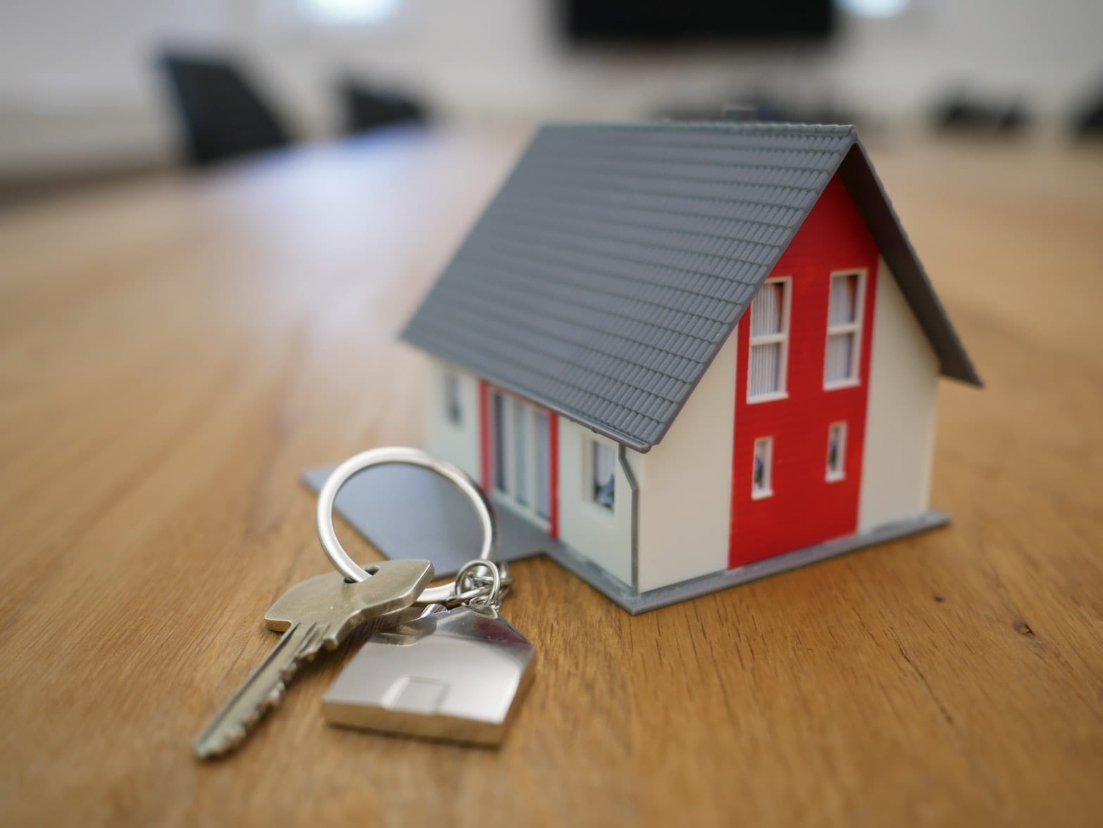keys attached to a house-shaped keychain